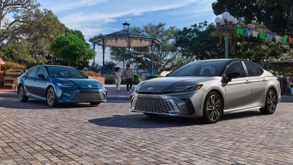 Two 2026 Toyota Corolla sedans parked in front of a gazebo