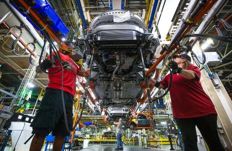 Factory Workers Assembling Vehicle at Fairfax GM Plant
