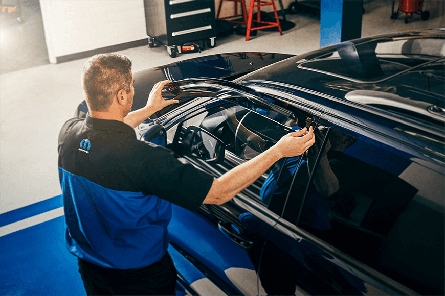 Gerry Lane CDJR Technician replacing vehicle window