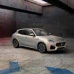 A grey 2023 Maserati Grecale Modena parked in a showroom