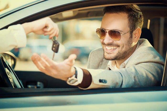 Businessman taking keys