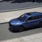 A blue 2026 Honda CR-V on a city street.