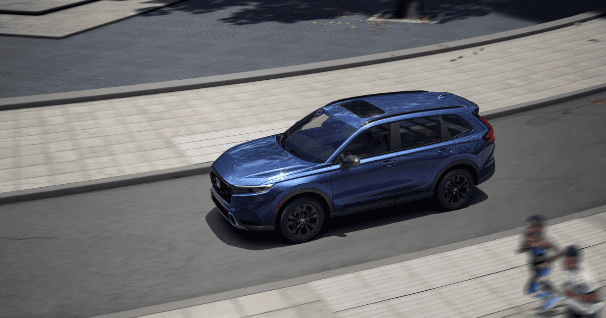 A blue 2026 Honda CR-V on a city street.
