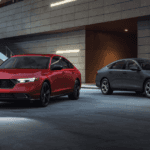 A Red Honda Accord and a grey Honda Accord parked beside each other at an angle