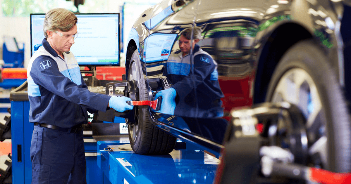 Honda tech working on vehicle