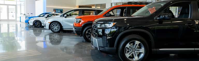 Honda models parked in Honda of Huntersville showroom