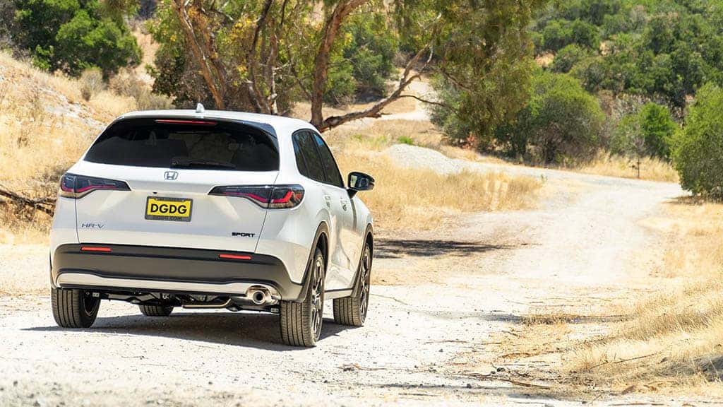 2023 Honda HR-V driving down a gravel path.