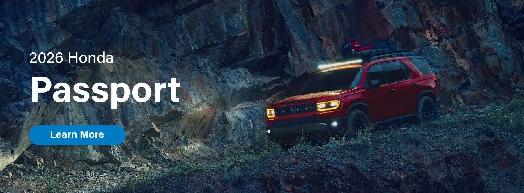 2026 Honda Passport driving down a rocky slope