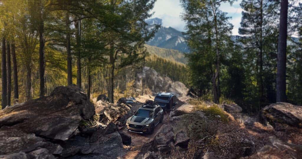 2025-Mazda-CX-50-Towing-a-Camper-through-the-mountains