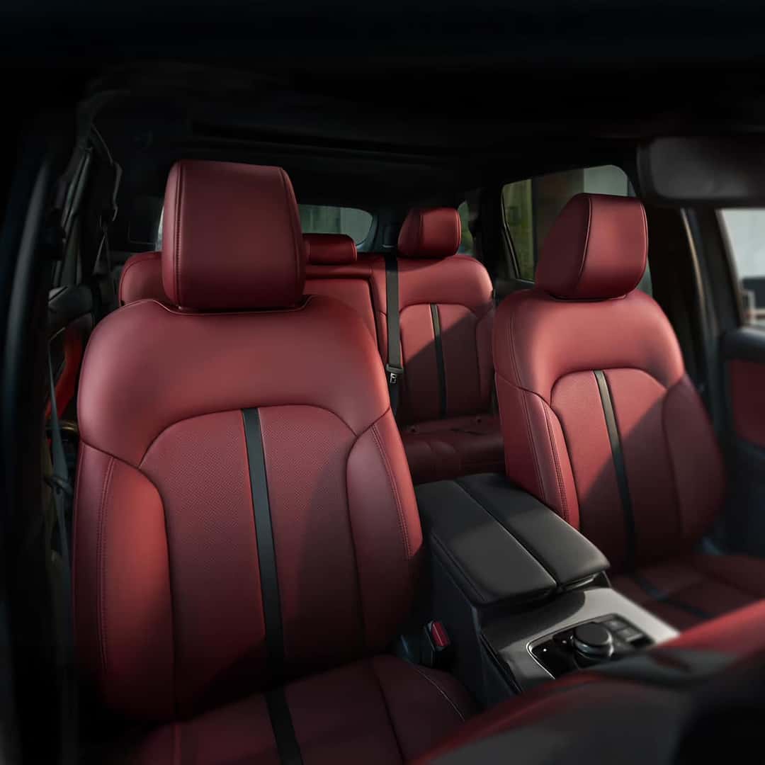 2025 Mazda CX-70 interior view from the dash backwards of the red interior