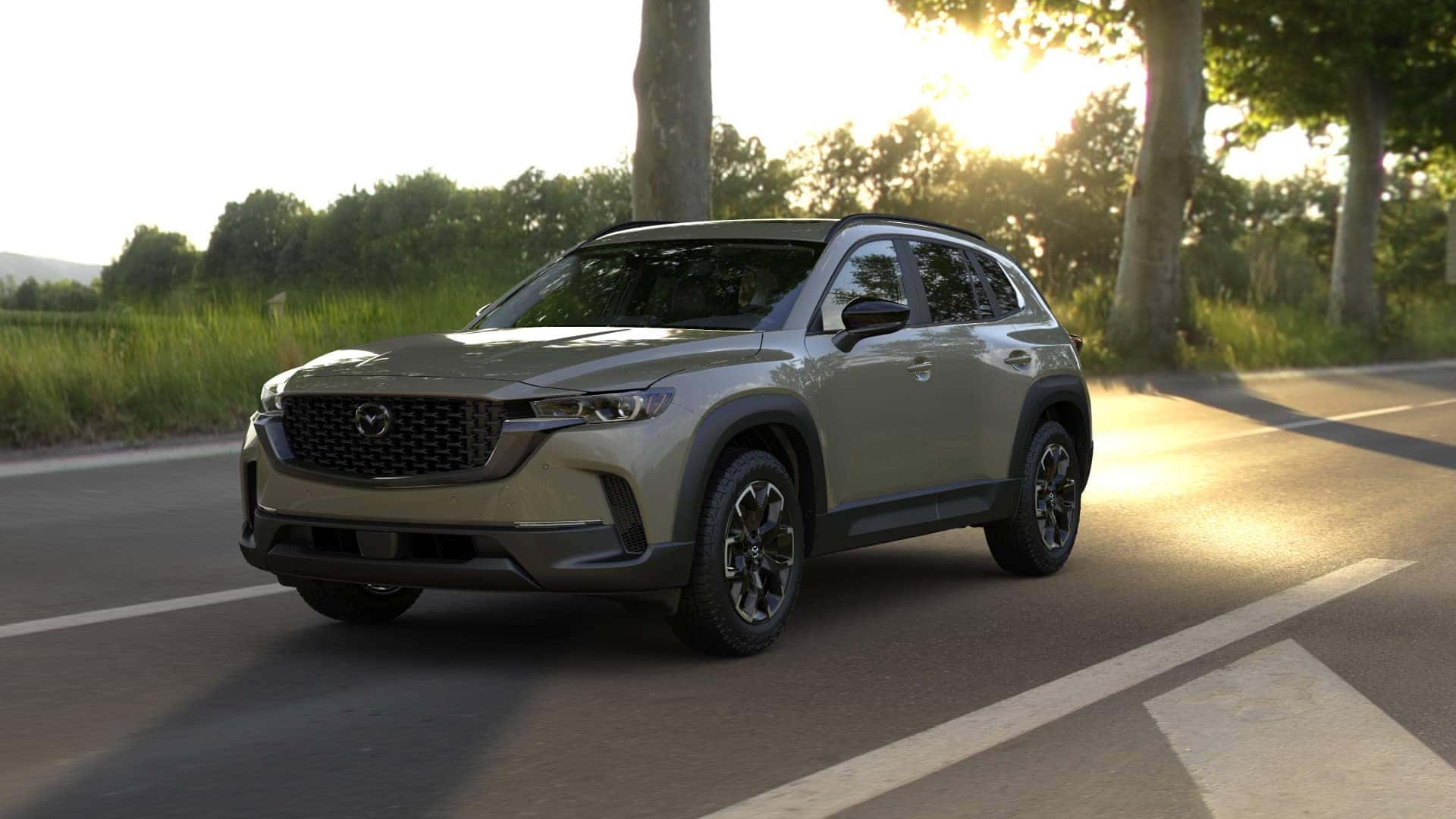 2026 Mazda CX‑50 2.5 S Meridian Edition trim level riving down a sunny countryside highway