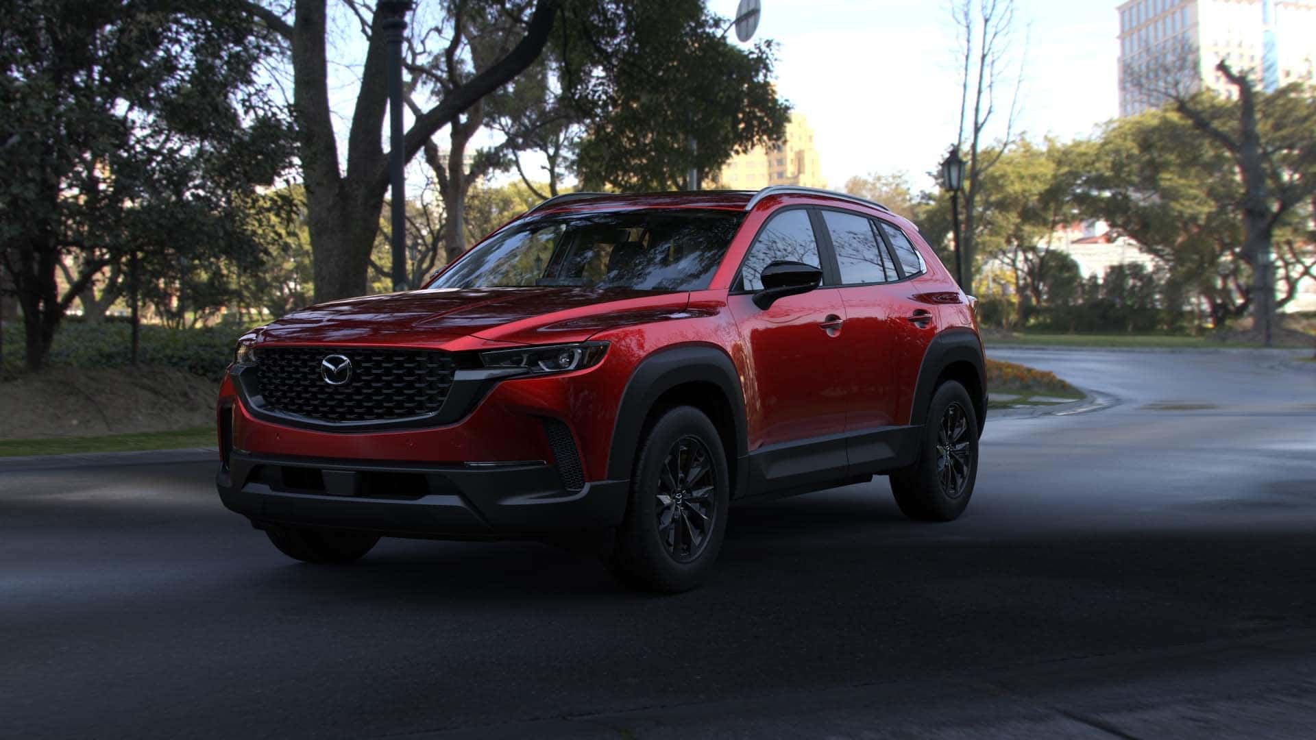 2026 Mazda CX‑50 Hybrid Preferred trim level riving through a park in Savannah, GA