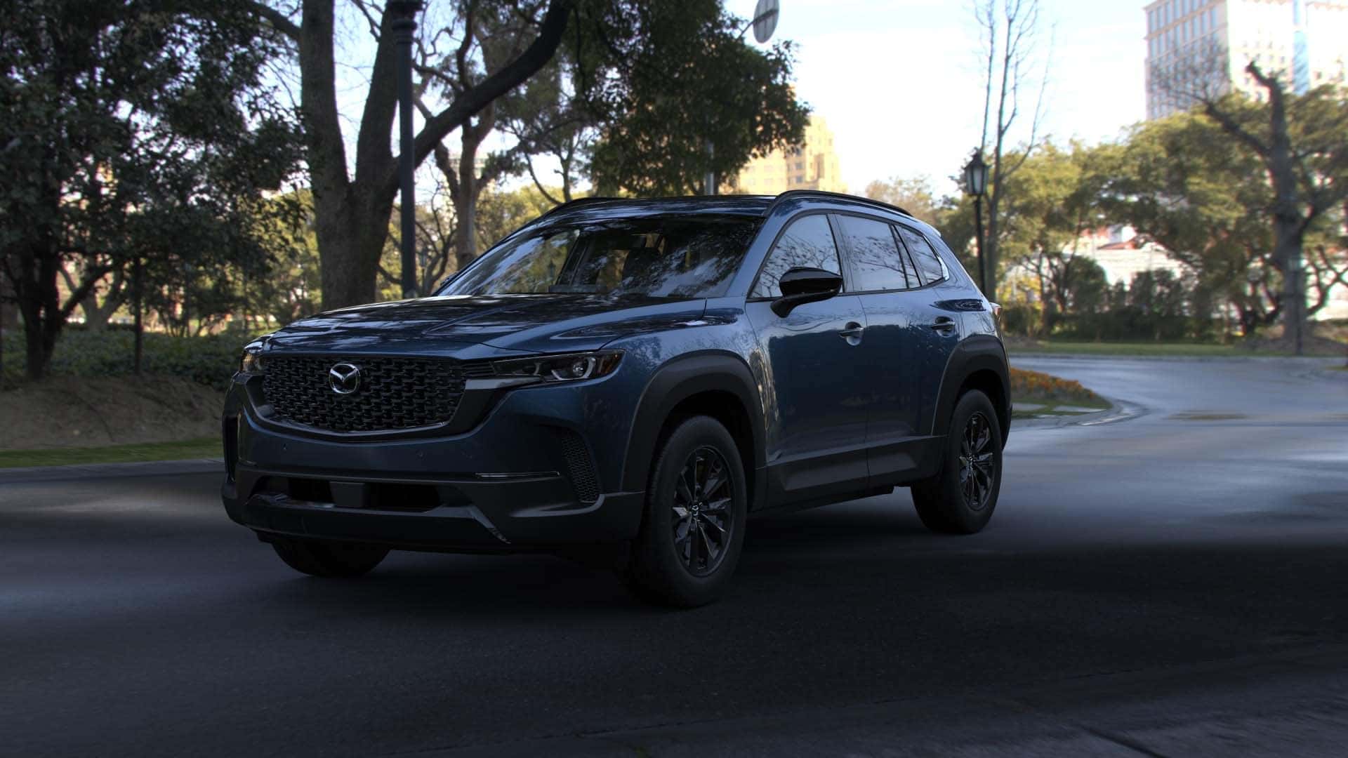 2026 Mazda CX‑50 Hybrid Premium trim level riving through a park in Savannah, GA