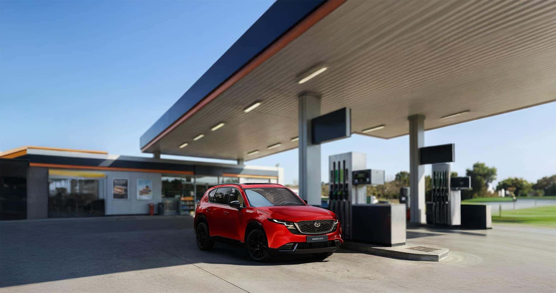 2026 Mazda CX-5 parked at a fuel pump