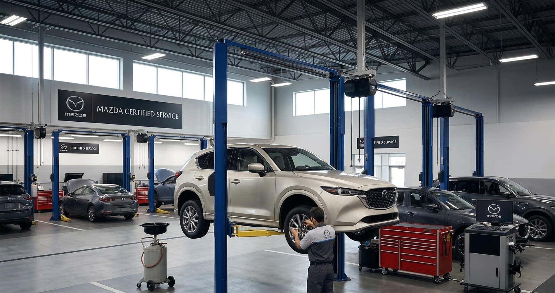 Mazda CX-5 receiving service in Mazda certified service center during routine maintenance