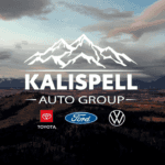 View of Kalispell MT at sunset with Kalispell Auto Group Toyota Ford and Volkswagen logo