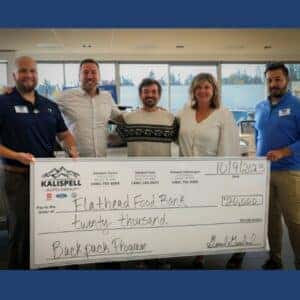 Kalispell Auto Group employees presenting a $20,000 check to the Flathead Food Bank