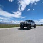 Blue and White Ford Bronco on a sunny summer day in Montana