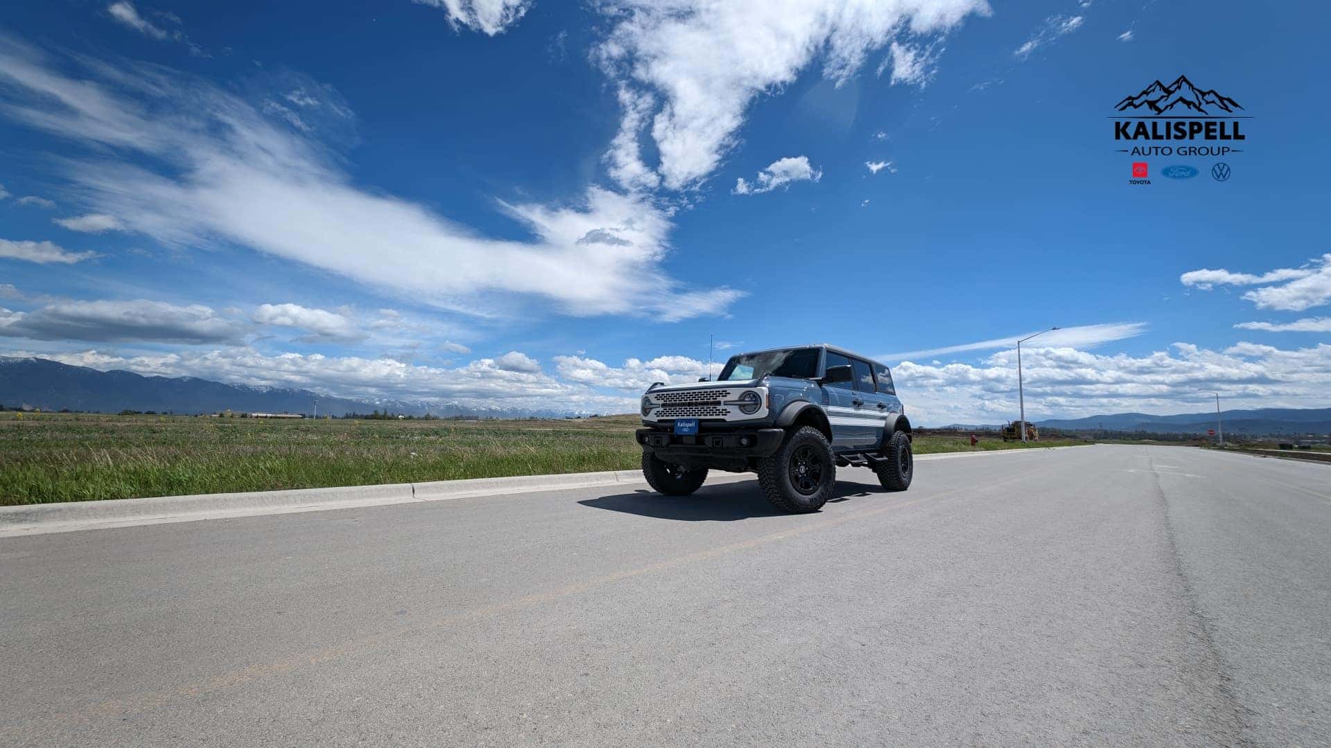 Blue and White Ford Bronco on a sunny summer day in Montana