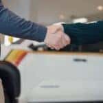 Kalispell Auto Group salesman shaking a customers hand