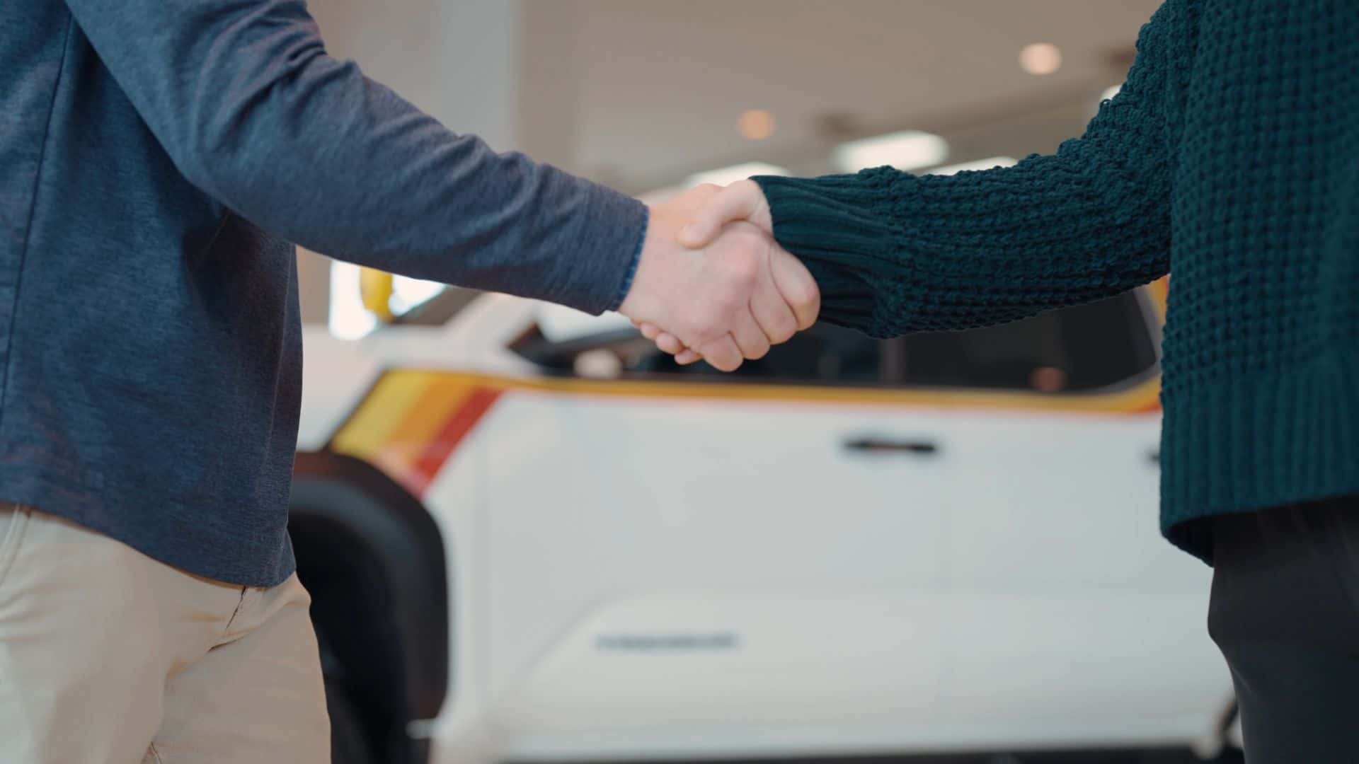 Kalispell Auto Group salesman shaking a customers hand