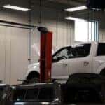 Ford truck on the lift and being worked on at Kalispell Ford