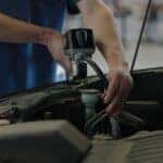 Technican working on a vehicle at the Kalispell Ford store in Flathead Valley