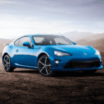 2020 blue Toyota 86 front side view in the desert