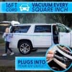 women holding a vacuum extending the 16ft cord plugged into the 12 volt outlet in her white SUV