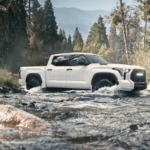 2022 white Tundra driving through a mountain stream