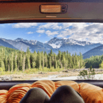 women camping from the back of her Toyota