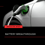 Silver electric vehicle being charged