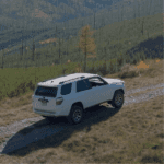 2023 Toyota 4Runner in white driving up a mountain