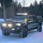 Black Toyota Tacoma custom build in the snow