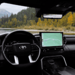 Interior of a 2024 Toyota Tundra looking out the windshield towards mountains and river
