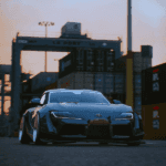 Toyota car in from of a shipping yard