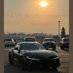 black Toyota Supra with sun shining