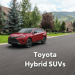 Toyota Venza in red driving down a neighborhood road
