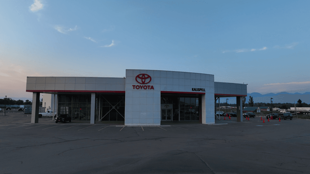 Kalispell Toyota Dealership during a cool autumn sunset. Rav4 sitting under the awning.
