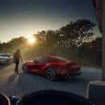 Two Toyota Supras outside during a Sunset