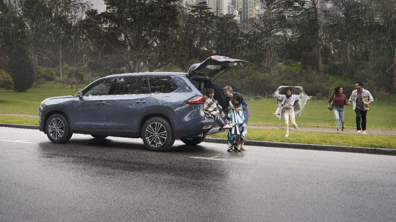 2024 Toyota Grand Highlander Hybrid picking up people from the park