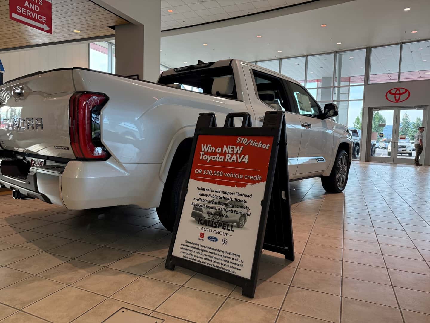 Raffle Sign next to a Toyota Tundra in our Kalispell Toyota showroom