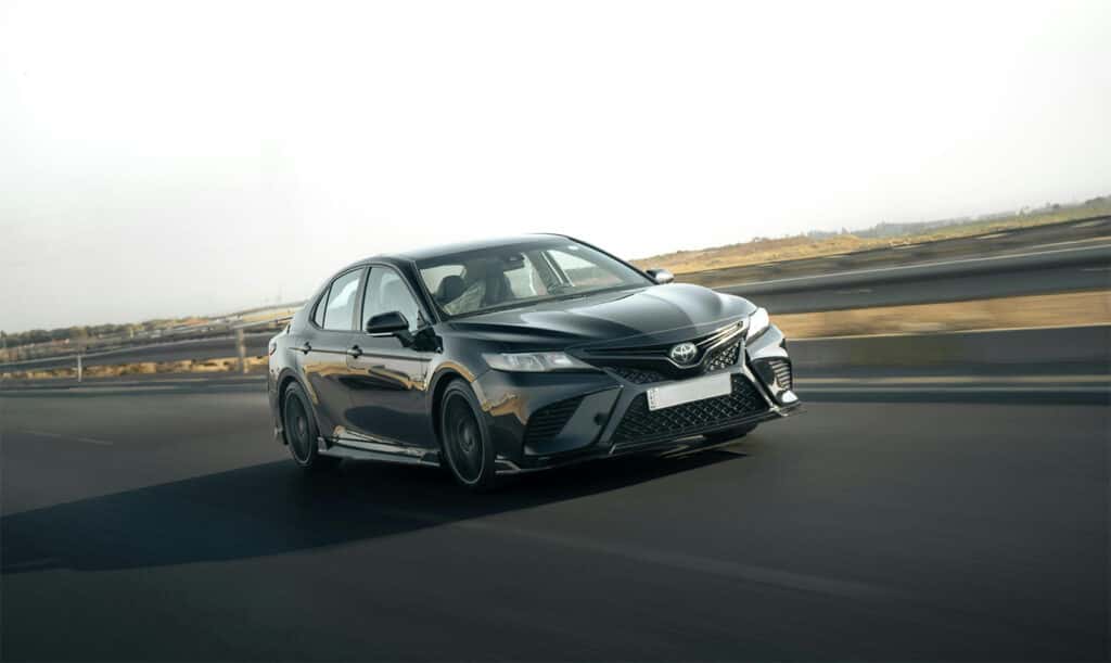 Gray Toyota sedan on the highway