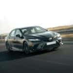 Gray Toyota sedan on the highway