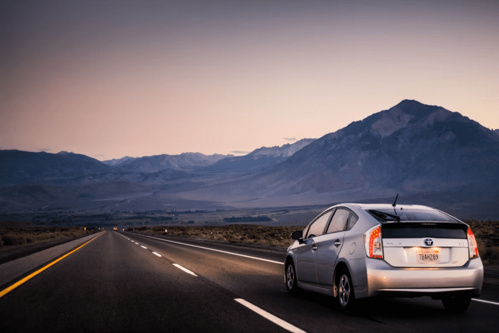 Toyota driving on open road at dusk