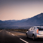 Toyota driving on open road at dusk