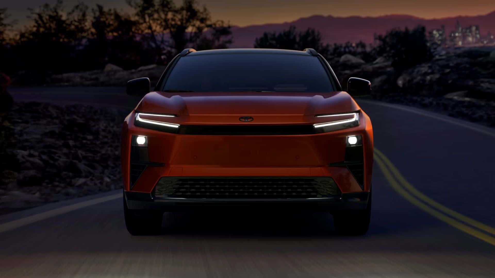 The all electric 2026 Toyota C-HR driving on a backroad