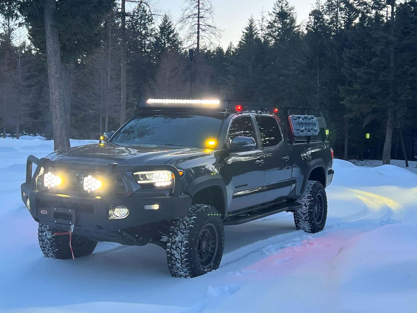 Lifted Toyota Tacoma in the Montana snow
