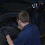 Kalispell Toyota certified technician inspecting tire tread