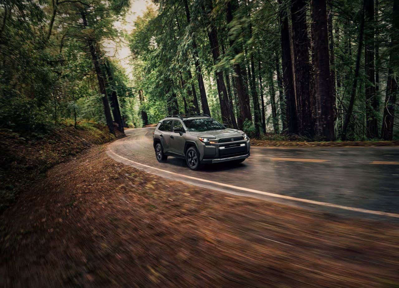 2026 Toyota Rav4 driving through a forest